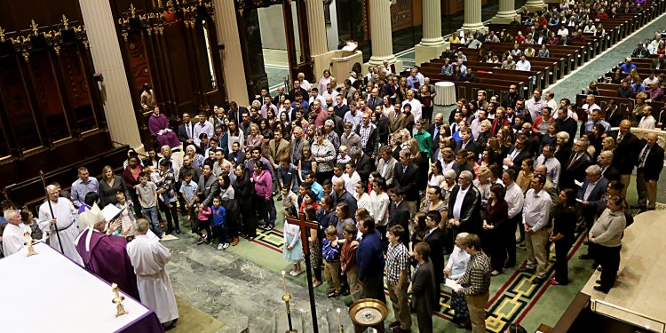 Auxiliary Bishop Joseph Binzer addresses the Catechumens and their godparents during the Rite of Election of Catechumens and of the Call to Continuing Conversion of Candidates who are preparing for Confirmation and Eucharist or Reception into Full Communion with the Roman Catholic Church at the Cathedral of St. Peter in Chains in Cincinnati Sunday, Mar. 5, 2017. (CT PHOTO/E.L. HUBBARD)