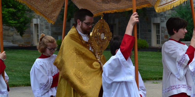 Fr. Alexander Witt arrives at the foot of the steps at the Athenauem of Ohio. (CT Photo/Greg Hartman