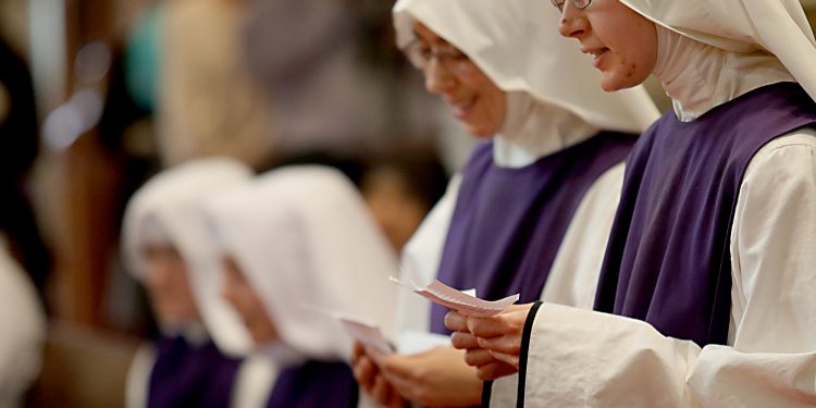 Sr. Antonetta Maria and Sr. Mary Consolata recite their intentions for the Ceremony of First Profession during the Feast of the Presentation of Mary at Our Lady of the Holy Spirit Center in Norwood Tuesday, Nov. 21, 2017. (CT Photo/E.L. Hubbard)