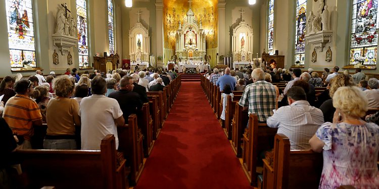 Archbishop Dennis Schnurr and the concelebrating priests prepare the Holy Eucharist during the 150th Anniversary Mass at St. Joseph Church in Hamilton Saturday, Sept. 16, 2017. (CT Photo/E.L. Hubbard)