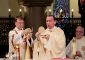 Archbishop Dennis Schnurr prepares the Holy Eucharist for the Mass of Thanksgiving for the 150th Anniversary of the Arrival of the Little Sisters of the Poor in Cincinnati at St. Monica-St. George Parish in Cincinnati Saturday, Oct. 20, 2018. (CT Photo/E.L. Hubbard)