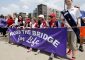 American Heritage Girls carry the banner during the Cross the Bridge for Life in Newport, Ky. Sunday, June 2, 2019. (CT Photo/E.L. Hubbard)