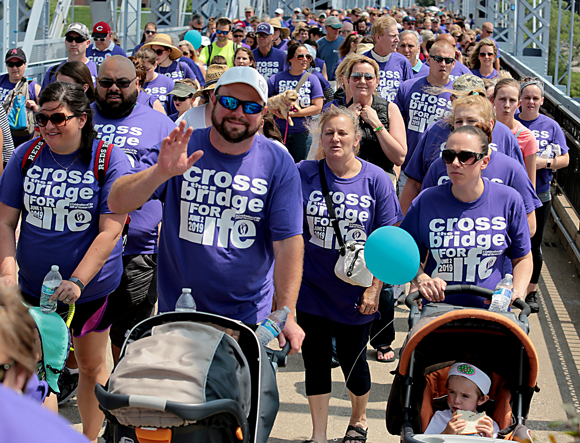 People cross the Purple People Bridge during the Cross the Bridge for Life in Newport, Ky. Sunday, June 2, 2019. (CT Photo/E.L. Hubbard)